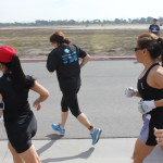 Cathy running (with white gloves)