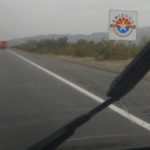 Rain falling on windshield as car enters Arizona